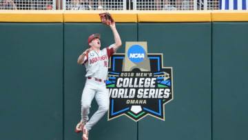 Jun 20, 2018; Omaha, NE, USA; Arkansas Razorbacks left fielder Heston Kjerstad (18) makes a catch against the wall in the second inning against the Texas Tech Red Raiders in the College World Series at TD Ameritrade Park. Mandatory Credit: Steven Branscombe-USA TODAY Sports