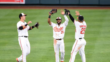 Sep 1, 2020; Baltimore, Maryland, USA; Baltimore Orioles outfielders Ryan Mountcastle (left), Cedric Mullins (center) and Anthony Santander (right) celebrate after beating the New York Mets 9-5 at Oriole Park at Camden Yards. Mandatory Credit: Evan Habeeb-USA TODAY Sports