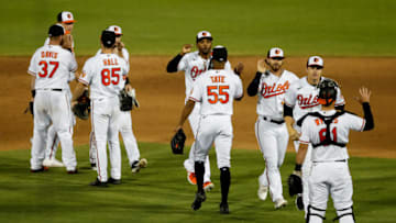 Mar 20, 2021; Sarasota, Florida, USA; Baltimore Orioles celebrate after beating the New York Yankees 2-1 during spring training at Ed Smith Stadium. Mandatory Credit: Nathan Ray Seebeck-USA TODAY Sports