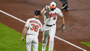 May 19, 2021; Baltimore, Maryland, USA; Baltimore Orioles right fielder Trey Mancini (16) celebrates with third base coach Tony Mansolino (36) after hitting a fifth inning home run against the Tampa Bay Rays at Oriole Park at Camden Yards. Mandatory Credit: Tommy Gilligan-USA TODAY Sports
