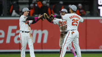 Baltimore Orioles left fielder Austin Hays (21) and Baltimore Orioles center fielder Cedric Mullins (31) and Baltimore Orioles right fielder Anthony Santander (25) celebrate. Mandatory Credit: Gregory Fisher-USA TODAY Sports