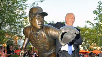 September 6, 2012; Baltimore, MD, USA; Cal Ripken poses with his statue after the Orioles Legends ceremony in his honor prior to a game against the New York Yankees at Oriole Park at Camden Yards. Mandatory Credit: Joy R. Absalon-USA TODAY Sports