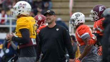 Jan 26, 2016; Fairhope, AL, USA; South squad head coach Gus Bradley of the Jacksonville Jaguars talks with players as they warm up during Senior Bowl practice at Fairhope Stadium. Mandatory Credit: Glenn Andrews-USA TODAY Sports