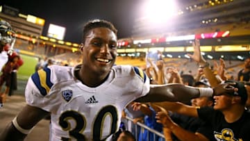 Sep 25, 2014; Tempe, AZ, USA; UCLA Bruins linebacker Myles Jack (30) celebrates with fans following the game against the Arizona State Sun Devils at Sun Devil Stadium. UCLA defeated Arizona State 62-27. Mandatory Credit: Mark J. Rebilas-USA TODAY Sports