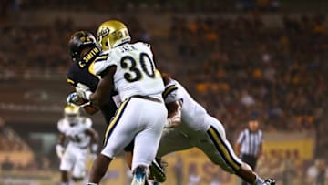 Sep 25, 2014; Tempe, AZ, USA; UCLA Bruins linebacker Myles Jack (30) tackles Arizona State Sun Devils wide receiver Cameron Smith at Sun Devil Stadium. UCLA defeated Arizona State 62-27. Mandatory Credit: Mark J. Rebilas-USA TODAY Sports