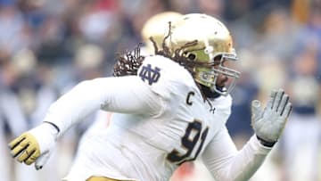 Nov 7, 2015; Pittsburgh, PA, USA; Notre Dame Fighting Irish defensive lineman Sheldon Day (91) breaks off of the line of scrimmage against the Pittsburgh Panthers during the fourth quarter at Heinz Field. Notre Dame won 42-30. Mandatory Credit: Charles LeClaire-USA TODAY Sports