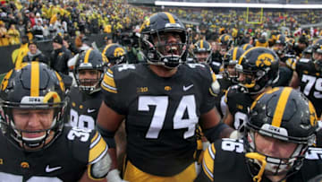 IOWA CITY, IOWA- NOVEMBER 23: Offensive lineman Tristan Wirfs #74 of the Iowa Hawkeyes celebrates with teammates after their match-up against the Nebraska Cornhuskers on November 23, 2018 at Kinnick Stadium, in Iowa City, Iowa. (Photo by Matthew Holst/Getty Images)