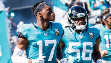 JACKSONVILLE, FLORIDA - OCTOBER 13: DJ Chark Jr. #17 and Quincy Williams #56 of the Jacksonville Jaguars charge onto the field before their team's game against the New Orleans Saints at TIAA Bank Field on October 13, 2019 in Jacksonville, Florida. (Photo by Harry Aaron/Getty Images)