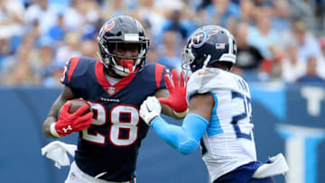 NASHVILLE, TN - SEPTEMBER 16: Alfred Blue #28 of the Houston Texans runs with the ball against Logan Ryan #26 of the Tennessee Titans durin the fourth quarter at Nissan Stadium on September 16, 2018 in Nashville, Tennessee. (Photo by Andy Lyons/Getty Images)