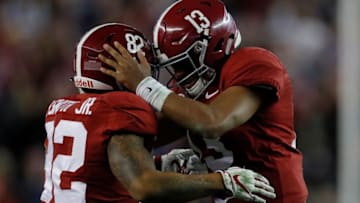 TUSCALOOSA, AL - NOVEMBER 24: Tua Tagovailoa #13 of the Alabama Crimson Tide reacts after passing for a touchdown to Henry Ruggs III #11 against the Auburn Tigers with Irv Smith Jr. #82 at Bryant-Denny Stadium on November 24, 2018 in Tuscaloosa, Alabama. (Photo by Kevin C. Cox/Getty Images)