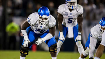 STATE COLLEGE, PA - SEPTEMBER 07: Kayode Awosika #73 of the Buffalo Bulls prepares to snap the ball against the Penn State Nittany Lions during the first half at Beaver Stadium on September 07, 2019 in State College, Pennsylvania. (Photo by Scott Taetsch/Getty Images)