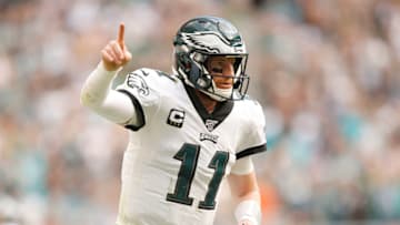 MIAMI, FLORIDA - DECEMBER 01: Carson Wentz #11 of the Philadelphia Eagles celebrates after throwing a touchdown to J.J. Arcega-Whiteside #19 (not pictured) against the Miami Dolphins during the second quarter at Hard Rock Stadium on December 01, 2019 in Miami, Florida. (Photo by Michael Reaves/Getty Images)