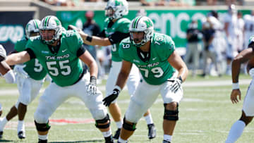 HUNTINGTON, WV - SEPTEMBER 05: Josh Ball #79 and Alex Mollette #55 of the Marshall Thundering Herd block during a game against the Eastern Kentucky Colonels at Joan C. Edwards Stadium on September 5, 2020 in Huntington, West Virginia. Marshall won 59-0. (Photo by Joe Robbins/Getty Images)