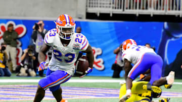ATLANTA, GEORGIA - DECEMBER 29: Chauncey Gardner-Johnson #23 of the Florida Gators intercepts the ball in the third quarter against the Michigan Wolverines during the Chick-fil-A Peach Bowl at Mercedes-Benz Stadium on December 29, 2018 in Atlanta, Georgia. (Photo by Scott Cunningham/Getty Images)