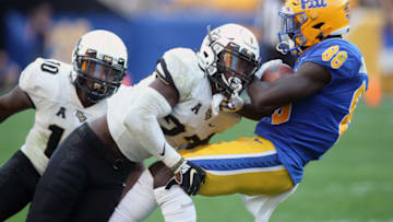 Sep 21, 2019; Pittsburgh, PA, USA; UCF Knights defensive back Richie Grant (27) tackles Pittsburgh Panthers wide receiver Dontavius Butler-Jenkins (88) after a catch during the third quarter at Heinz Field. Mandatory Credit: Charles LeClaire-USA TODAY Sports
