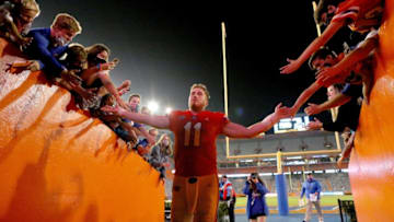 Nov 14, 2020; Gainesville, FL, USA; Florida quarterback Kyle Trask (11) is congratulated by fans as he leaves the field after the Gators beat Arkansas in a football game at Ben Hill Griffin Stadium in Gainesville, Fla. Nov. 14, 2020. Mandatory Credit: Brad McClenny-USA TODAY NETWORK