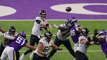 Dec 6, 2020; Minneapolis, Minnesota, USA; Jacksonville Jaguars quarterback Mike Glennon (2) passes in the fourth quarter against the Minnesota Vikings at U.S. Bank Stadium. Mandatory Credit: Brad Rempel-USA TODAY Sports