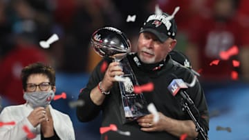 Feb 7, 2021; Tampa, FL, USA; Tampa Bay Buccaneers head coach Bruce Arians hoists the Vince Lombardi Trophy after defeating the Kansas City Chiefs in Super Bowl LV at Raymond James Stadium. Mandatory Credit: Matthew Emmons-USA TODAY Sports