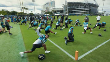A group of Jacksonville Jaguars players go through stretching drills. (Imagn Images photo pool)