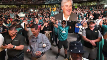 A Jaguars fan holds a oversized photo of the team's new head coach, Doug Pederson during the announcement of the team's first round draft pick Thursday evening. Jacksonville Jaguar fans showed up at Daily's Place for the 2022 NFL Draft party which saw the Jaguars pick University of Georgia edge rusher Travon Walker as their first pick of the draft where the team had the first overall draft pick Thursday evening, April 28, 2022. [Bob Self/Florida Times-Union]Jki 042822 Jags2022draftpa 2