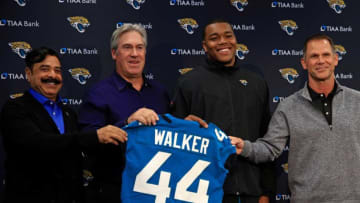 Jaguars owner Shad Khan, head coach Doug Pederson, first-round draft pick Travon Walker and general manager Trent Baalke pose for a photo.Syndication Florida Times Union