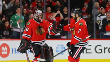 Jan 12, 2016; Chicago, IL, USA; Chicago Blackhawks defenseman Brent Seabrook (7) celebrates with goalie Corey Crawford (50) after scoring a goal during the second period against the Nashville Predators at the United Center. Mandatory Credit: Dennis Wierzbicki-USA TODAY Sports