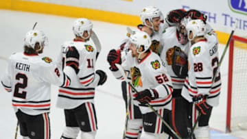Jan 19, 2016; Nashville, TN, USA; Chicago Blackhawks goalie Corey Crawford (50) celebrates with teammates after defeating the Nashville Predators 4-1 at Bridgestone Arena. Mandatory Credit: Christopher Hanewinckel-USA TODAY Sports