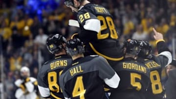 Jan 31, 2016; Nashville, TN, USA; Pacific Division forward John Scott (28) of the Montreal Canadiens is picked up by his teammates after beating the Atlantic Division during the championship game of the 2016 NHL All Star Game at Bridgestone Arena. Mandatory Credit: Christopher Hanewinckel-USA TODAY Sports