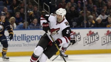 Dec 4, 2015; Buffalo, NY, USA; Arizona Coyotes left wing John Scott (28) looks for the puck during the first period against the Buffalo Sabres at First Niagara Center. Mandatory Credit: Timothy T. Ludwig-USA TODAY Sports