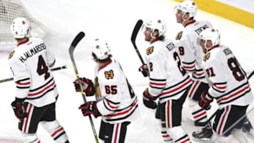 Jan 14, 2016; Montreal, Quebec, CAN; Chicago Blackhawks center Jonathan Toews (19) celebrates his goal against the Montreal Canadiens with teammates during the first period at Bell Centre. Mandatory Credit: Jean-Yves Ahern-USA TODAY Sports