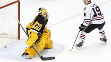 Jan 21, 2015; Pittsburgh, PA, USA; Chicago Blackhawks center Jonathan Toews (19) scores a goal past Pittsburgh Penguins goalie Marc-Andre Fleury (29) during the shootout at the CONSOL Energy Center. The Blackhawks won 3-2 in a shootout. Mandatory Credit: Charles LeClaire-USA TODAY Sports