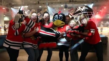 Jan 29, 2016; Nashville, TN, USA; The Chicago Blackhawks mascot interacts with a group of fans during the fan fair for the 2016 NHL All Star Game at Bridgestone Arena. Mandatory Credit: Aaron Doster-USA TODAY Sports