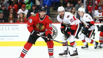 Jan 3, 2016; Chicago, IL, USA; Chicago Blackhawks right wing Patrick Kane (88) controls the puck against Ottawa Senators center Zack Smith (15) during the first period at the United Center. Mandatory Credit: Jerry Lai-USA TODAY Sports