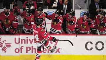 Jan 8, 2016; Chicago, IL, USA; Chicago Blackhawks left wing Phillip Danault (C) celebrates his first NHL goal against the Buffalo Sabres during the third period at the United Center. The Blackhawks won 3-1. Mandatory Credit: David Banks-USA TODAY Sports