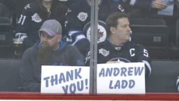 Feb 23, 2016; Winnipeg, Manitoba, CAN; Winnipeg Jets fans thank Winnipeg Jets left wing Andrew Ladd (16) prior to the game against the Dallas Stars at MTS Centre. Mandatory Credit: Bruce Fedyck-USA TODAY Sports