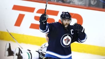 Feb 23, 2016; Winnipeg, Manitoba, CAN; Winnipeg Jets left wing Andrew Ladd (16) celebrates after scoring a goal against the Dallas Stars during the second period at MTS Centre. Mandatory Credit: Bruce Fedyck-USA TODAY Sports