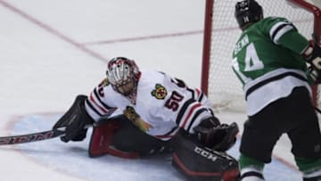 Feb 6, 2016; Dallas, TX, USA; Dallas Stars left wing Jamie Benn (14) misses an open net as Chicago Blackhawks goalie Corey Crawford (50) defends during the first period at the American Airlines Center. Mandatory Credit: Jerome Miron-USA TODAY Sports