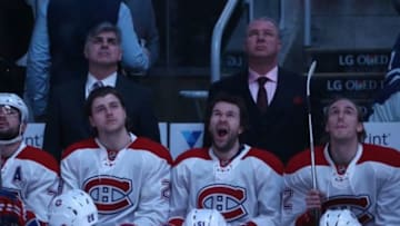 Jan 23, 2016; Toronto, Ontario, CAN; Montreal Canadiens assistant coach J.J. Daigneault and head coach Michel Therrien and defenseman Nathan Beaulieu (28) look on as center David Desharnais (51) yawns and right wing Dale Weise (22) looks on during a ceremony before the game honoring former Maple Leafs player Dave Keon (14) prior to their game against the Toronto Maple Leafs at Air Canada Centre. The Canadiens beat the Maple Leafs 3-2. Mandatory Credit: Tom Szczerbowski-USA TODAY Sports