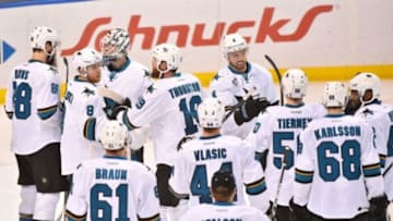 Feb 4, 2016; St. Louis, MO, USA; San Jose Sharks teammates celebrate defeating the St. Louis Blues 3-1 at Scottrade Center. Mandatory Credit: Jasen Vinlove-USA TODAY Sports