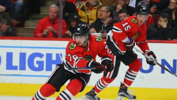 Feb 25, 2016; Chicago, IL, USA; Chicago Blackhawks left wing Artemi Panarin (72) passes the puck with center Artem Anisimov (15) pursuing during the second period against the Nashville Predators at the United Center. Mandatory Credit: Dennis Wierzbicki-USA TODAY Sports