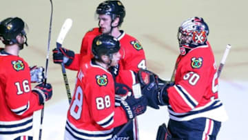 Mar 6, 2016; Chicago, IL, USA; Chicago Blackhawks goalie Corey Crawford (50) is congratulated by right wing Patrick Kane (88) following the third period against the Detroit Red Wings at the United Center. Chicago won 4-1. Credit: Dennis Wierzbicki-USA TODAY Sports