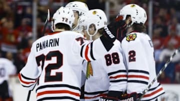 Mar 2, 2016; Detroit, MI, USA; Chicago Blackhawks right wing Patrick Kane (88) receives congratulations from teammates after scoring in the second period against the Detroit Red Wings at Joe Louis Arena. Mandatory Credit: Rick Osentoski-USA TODAY Sports