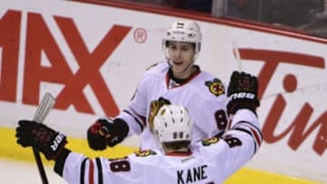 Mar 27, 2016; Vancouver, British Columbia, CAN; Chicago Blackhawks forward Patrick Kane (88) celebrates forward Teuvo Teravainen (86) goal against Vancouver Canucks goaltender Ryan Miller (30) (not pictured) during the third period at Rogers Arena. The Chicago Blackhawks won 3-2. Mandatory Credit: Anne-Marie Sorvin-USA TODAY Sports