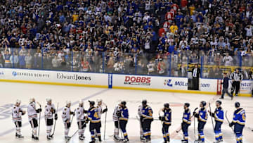 Apr 25, 2016; St. Louis, MO, USA; St. Louis Blues and Chicago Blackhawks teammates line up to shake hands after St. Louis Blues defeat the Chicago Blackhawks 3-2 in game seven of the first round of the 2016 Stanley Cup Playoffs at Scottrade Center. Mandatory Credit: Jasen Vinlove-USA TODAY Sports