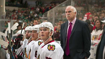 Mar 11, 2016; Dallas, TX, USA; Chicago Blackhawks center Jonathan Toews (19) and head coach Joel Quenneville watch their team take on the Dallas Stars during the third period at American Airlines Center. The Stars defeat the Blackhawks 5-2. Mandatory Credit: Jerome Miron-USA TODAY Sports