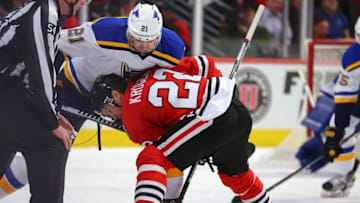 Apr 7, 2016; Chicago, IL, USA; Chicago Blackhawks center Marcus Kruger (22) and St. Louis Blues center Patrik Berglund (21) fight for a face off during the first period at the United Center. Mandatory Credit: Dennis Wierzbicki-USA TODAY Sports