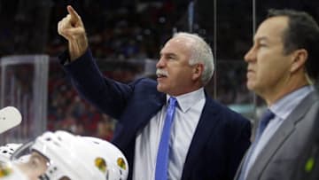 Jan 26, 2016; Raleigh, NC, USA; Chicago Blackhawks head coach Joel Quenneville reacts from behind the bench against the Carolina Hurricanes at PNC Arena. The Carolina Hurricanes defeated the Chicago Blackhawks 5-0. Mandatory Credit: James Guillory-USA TODAY Sports