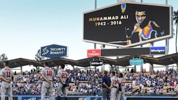 Jun 4, 2016; Los Angeles, CA, USA; Atlanta Braves players observe a moment of silence honoring Muhammad Ali before their game against the Los Angeles Dodgers at Dodger Stadium. Ali passed away Friday June 3, 2016. Mandatory Credit: Robert Hanashiro-USA TODAY Sports