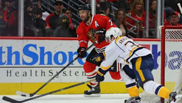 Feb 25, 2016; Chicago, IL, USA; Chicago Blackhawks defenseman Brent Seabrook (7) being pursued by Nashville Predators right wing Viktor Arvidsson (38) during the second period at the United Center. Mandatory Credit: Dennis Wierzbicki-USA TODAY Sports