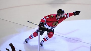 Jan 8, 2016; Chicago, IL, USA; Chicago Blackhawks defenseman Niklas Hjalmarsson (4) celebrates his goal against the Buffalo Sabres during the first period at the United Center. Mandatory Credit: David Banks-USA TODAY Sports